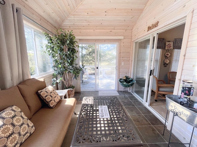 sunroom featuring a healthy amount of sunlight, wood ceiling, and vaulted ceiling