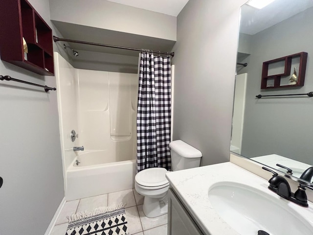 bathroom with vanity, baseboards, shower / bath combo with shower curtain, tile patterned floors, and toilet