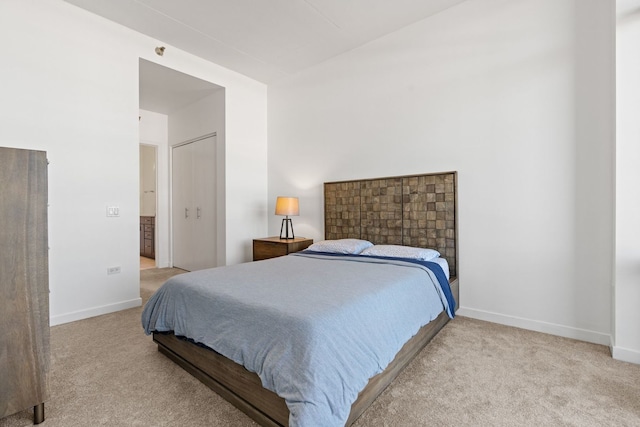 carpeted bedroom with baseboards