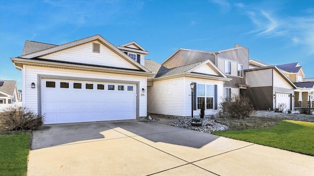 view of front of property featuring an attached garage and concrete driveway