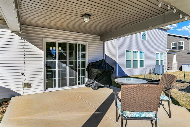 view of patio featuring central AC and a grill