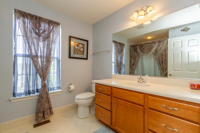 full bath featuring vanity, toilet, visible vents, and tile patterned flooring