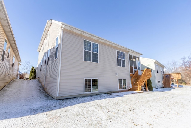 back of property featuring stairs