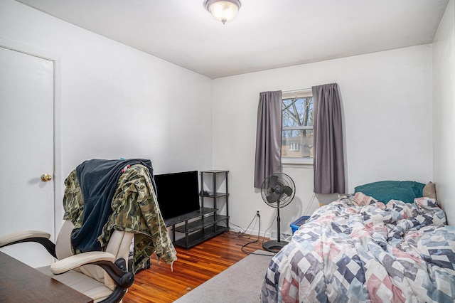 bedroom featuring wood finished floors