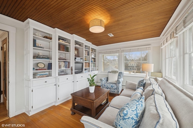 living area with light wood finished floors, visible vents, wooden ceiling, and a baseboard radiator