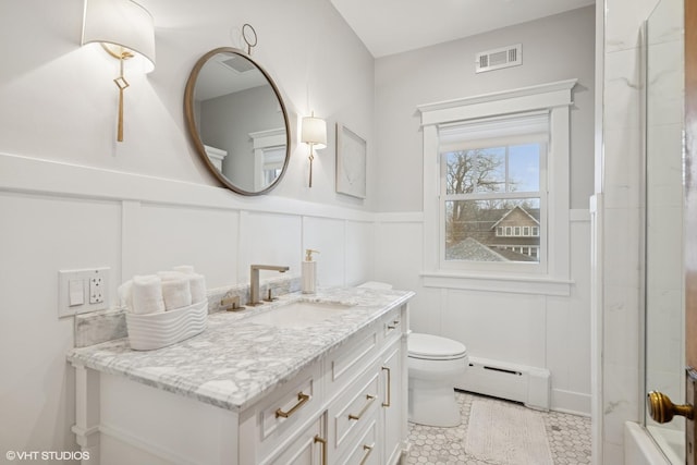 full bathroom with visible vents, toilet, a baseboard heating unit, wainscoting, and vanity