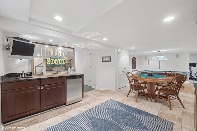 kitchen with refrigerator, recessed lighting, and a sink