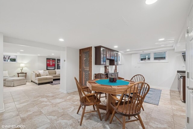 dining room with recessed lighting and baseboards