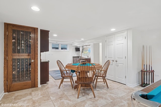 dining room with recessed lighting and baseboards