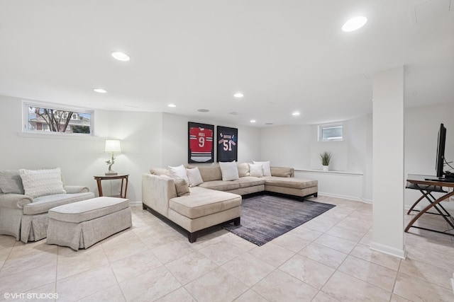 living room featuring recessed lighting, a healthy amount of sunlight, and light tile patterned flooring