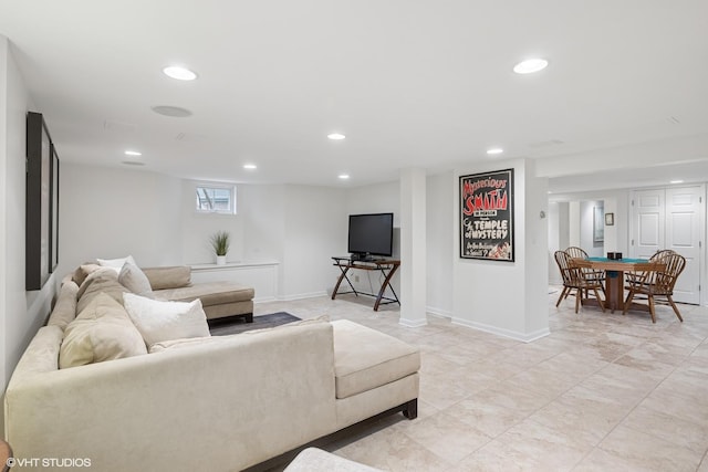 living area with recessed lighting and baseboards