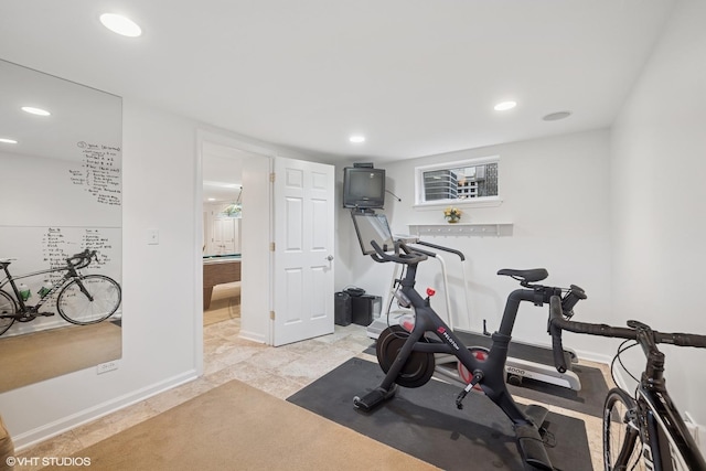 exercise area with recessed lighting and baseboards