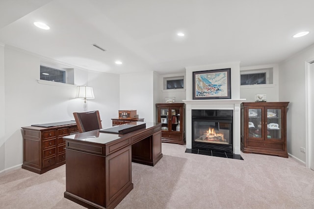 home office featuring recessed lighting, baseboards, a fireplace with flush hearth, and light colored carpet