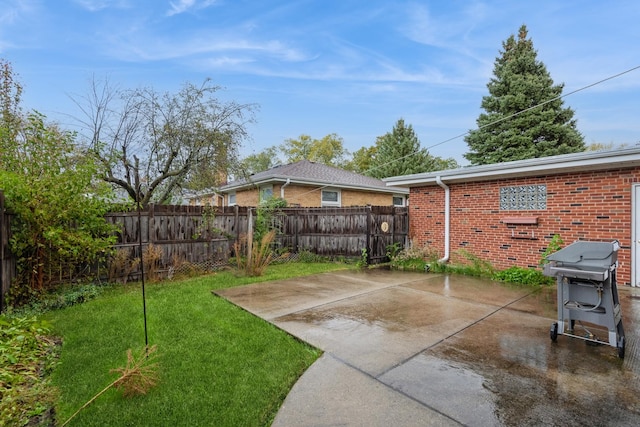 view of yard with fence and a patio area