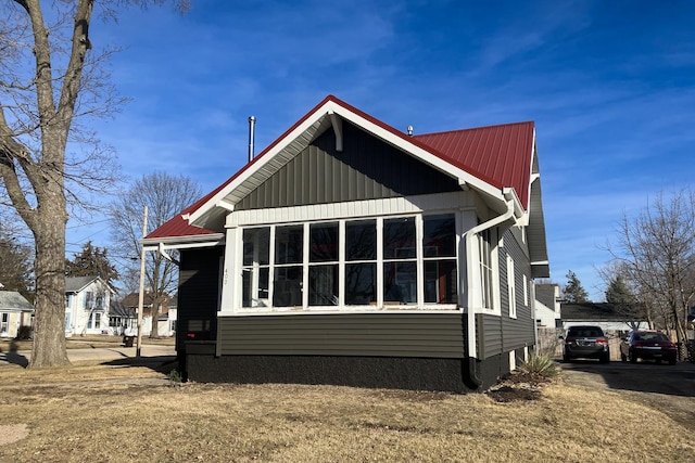 exterior space featuring metal roof