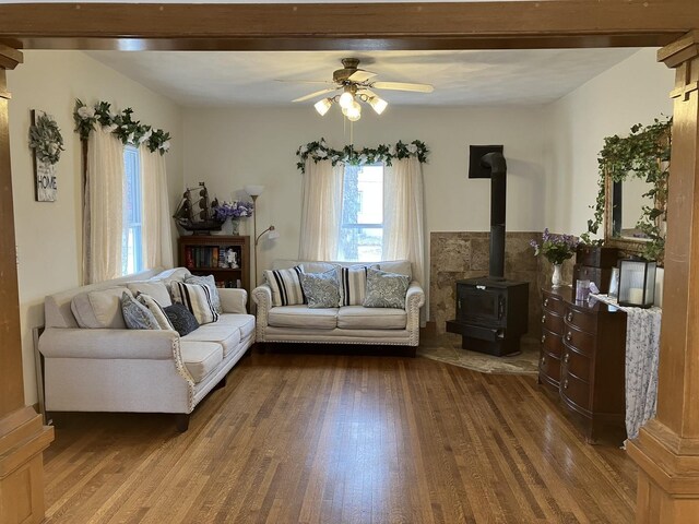 dining space featuring baseboards, dark wood-type flooring, and ornate columns