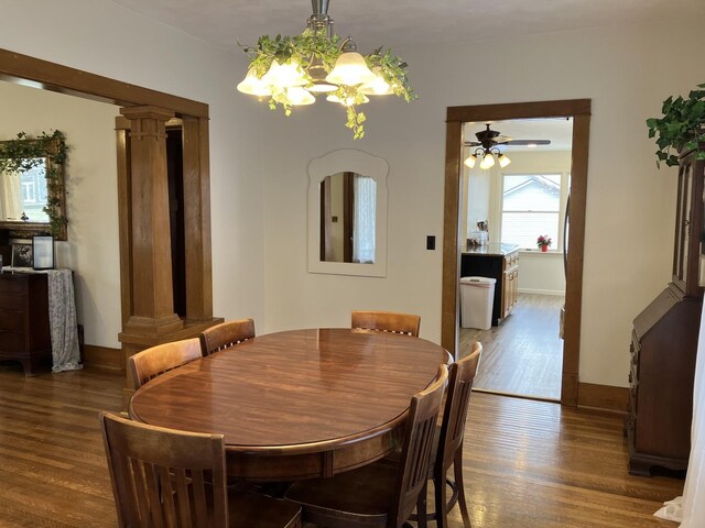 kitchen with dark stone countertops, wood finished floors, recessed lighting, a sink, and appliances with stainless steel finishes