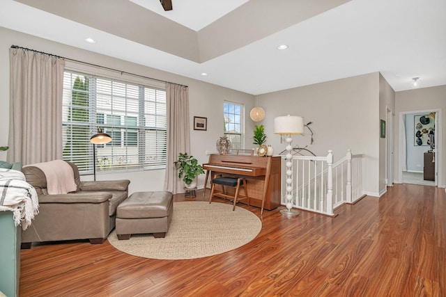 interior space featuring recessed lighting, baseboards, and wood finished floors