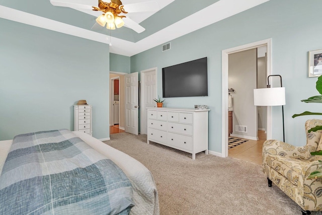 bedroom featuring light carpet, baseboards, and visible vents