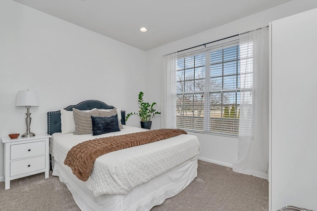 carpeted bedroom with baseboards and recessed lighting