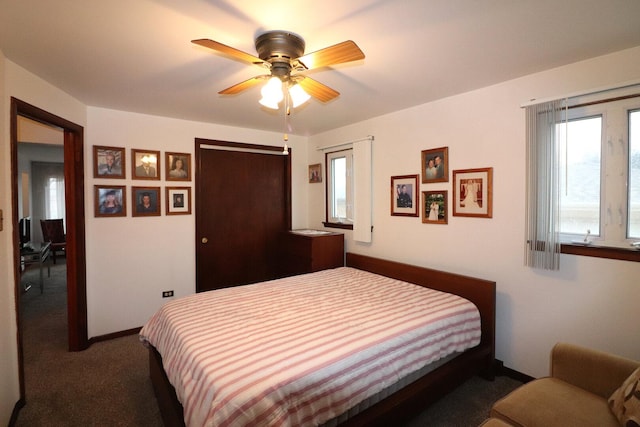 bedroom with a closet, carpet floors, baseboards, and ceiling fan