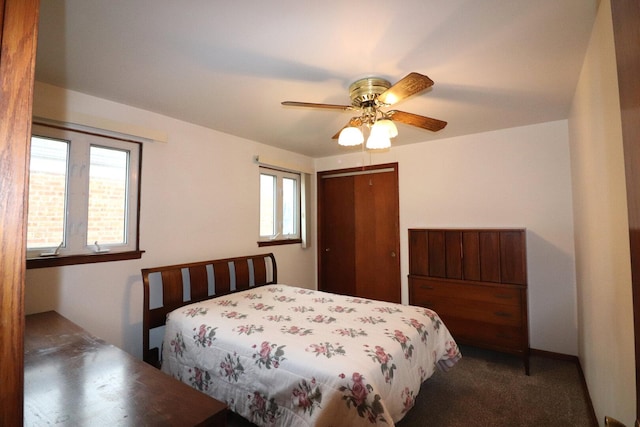 bedroom featuring a closet, ceiling fan, and carpet