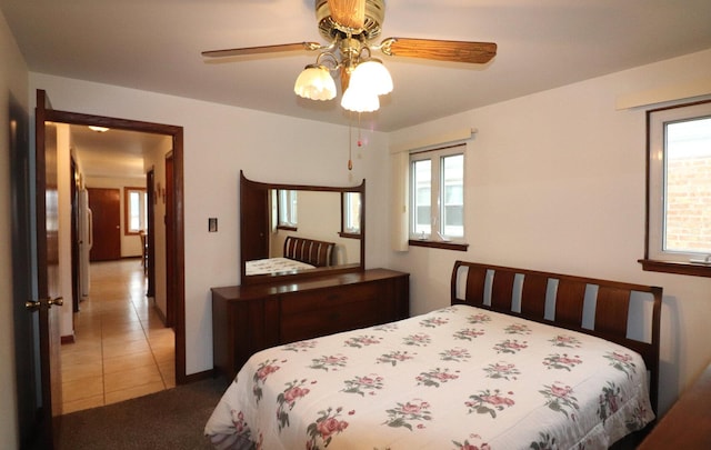 bedroom with tile patterned flooring and ceiling fan