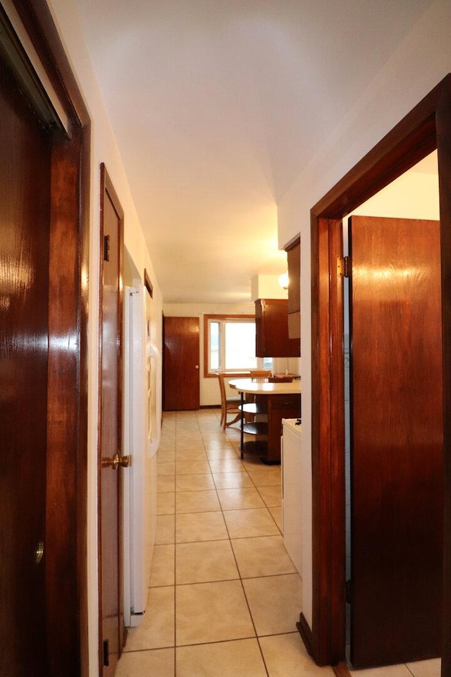 hallway featuring light tile patterned floors