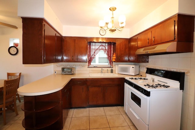 kitchen with white appliances, open shelves, a sink, light countertops, and under cabinet range hood