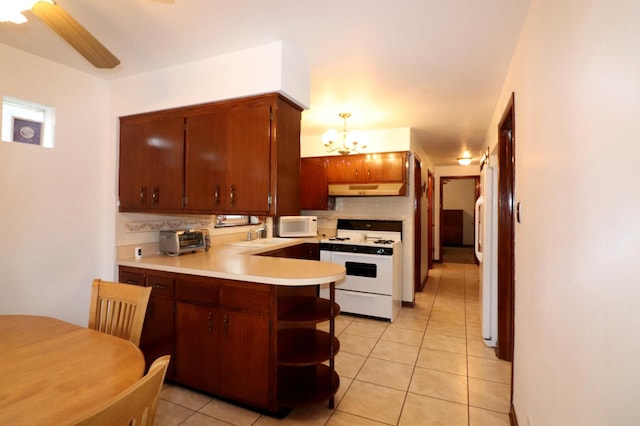 kitchen featuring ventilation hood, light countertops, a peninsula, white appliances, and open shelves