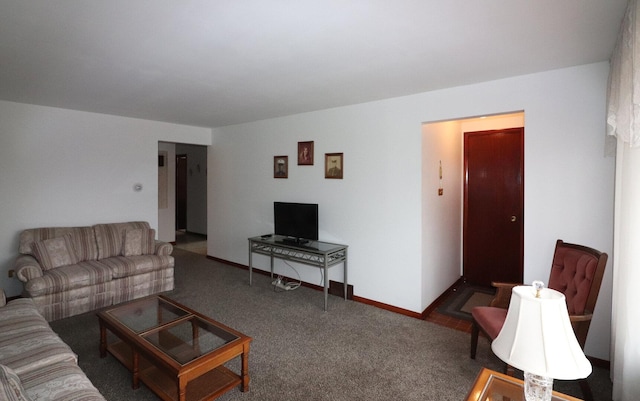 carpeted living room with baseboards