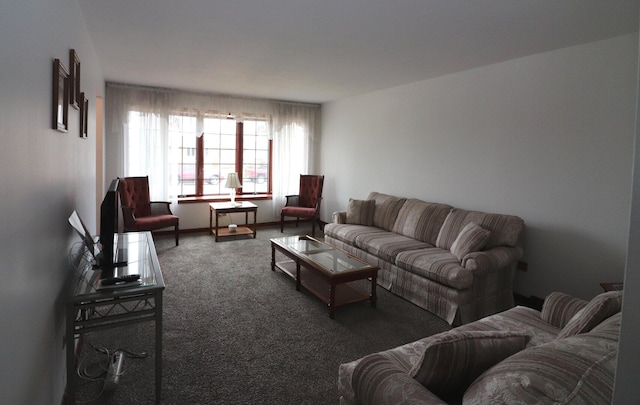 carpeted living area featuring baseboards