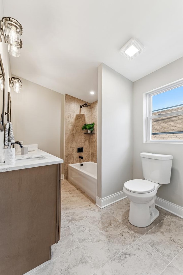 full bath featuring baseboards, toilet, vanity, and shower / tub combination