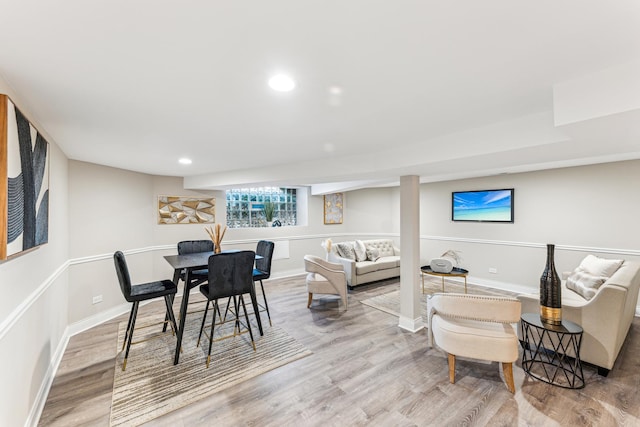 dining area featuring recessed lighting, baseboards, and wood finished floors