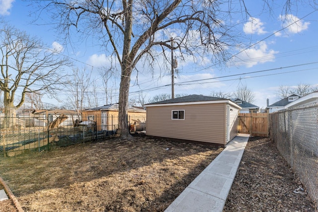 view of yard featuring an outbuilding and a fenced backyard