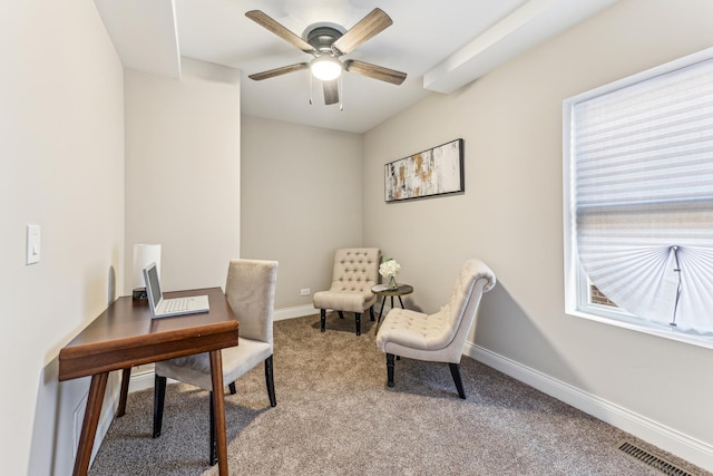 carpeted home office with visible vents, baseboards, and ceiling fan