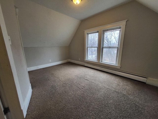 bonus room featuring vaulted ceiling, carpet flooring, baseboards, and a baseboard radiator