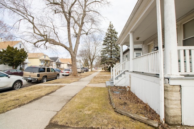 exterior space featuring sidewalks and a residential view