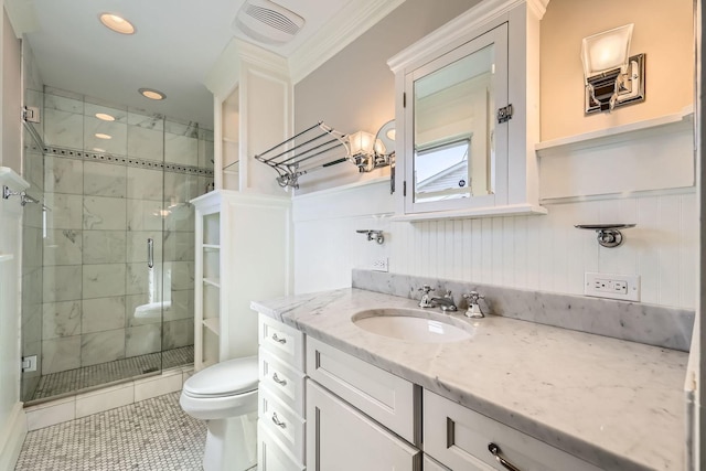 full bath featuring visible vents, toilet, a stall shower, wainscoting, and vanity