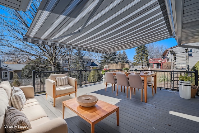 deck featuring outdoor dining area and an outdoor hangout area