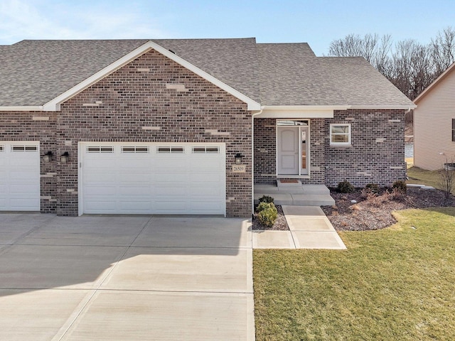 view of front facade with a garage, brick siding, driveway, and a shingled roof