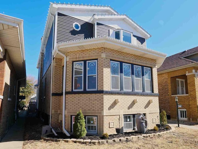 exterior space featuring brick siding