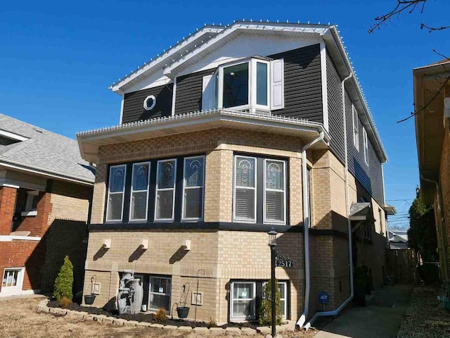 view of front of house featuring brick siding