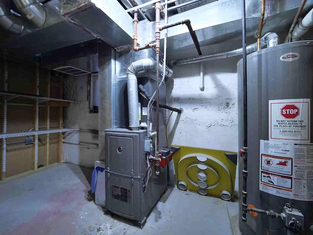 utility room featuring gas water heater