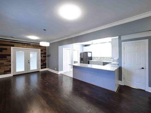 kitchen featuring stainless steel fridge with ice dispenser, dark wood-type flooring, french doors, crown molding, and decorative light fixtures