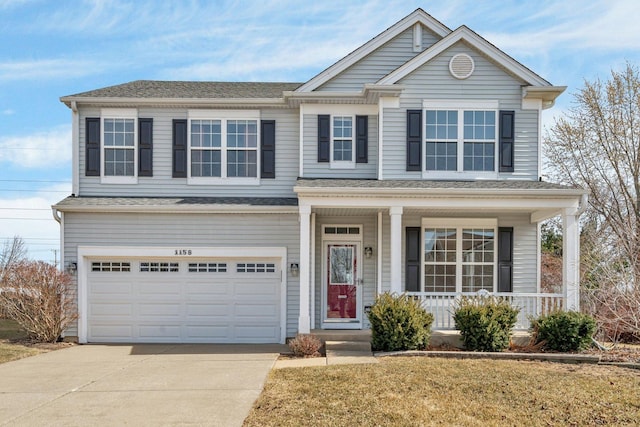 traditional-style home with a garage, roof with shingles, a porch, and driveway