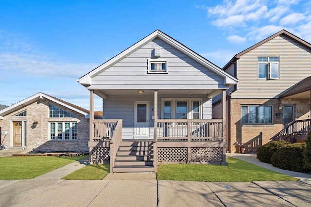 bungalow-style home with brick siding and a porch