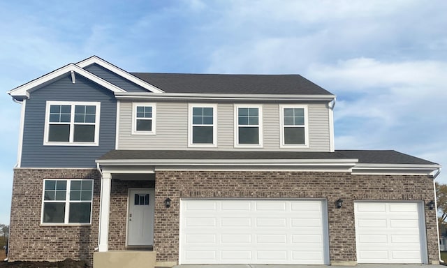 view of front facade featuring brick siding, driveway, and a shingled roof