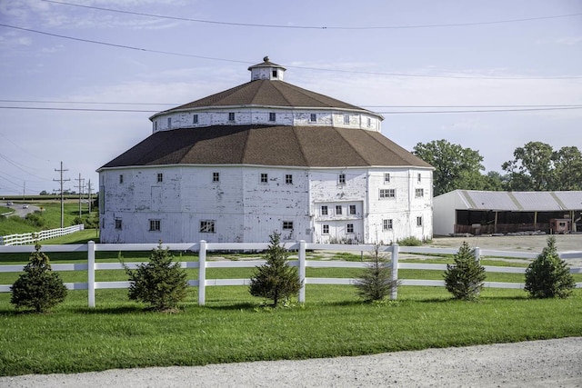 view of building exterior with fence