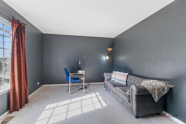 office featuring visible vents, carpet flooring, and baseboards